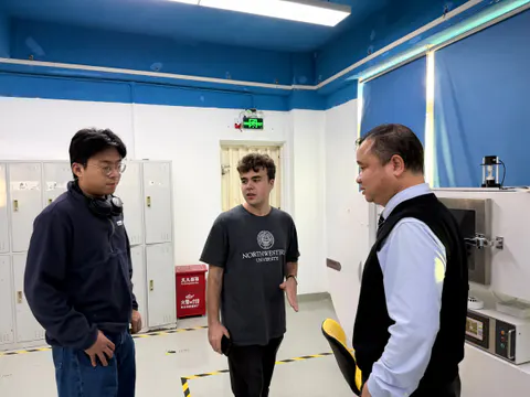 Visitors speaking with a Shenzhen company team during a business visit