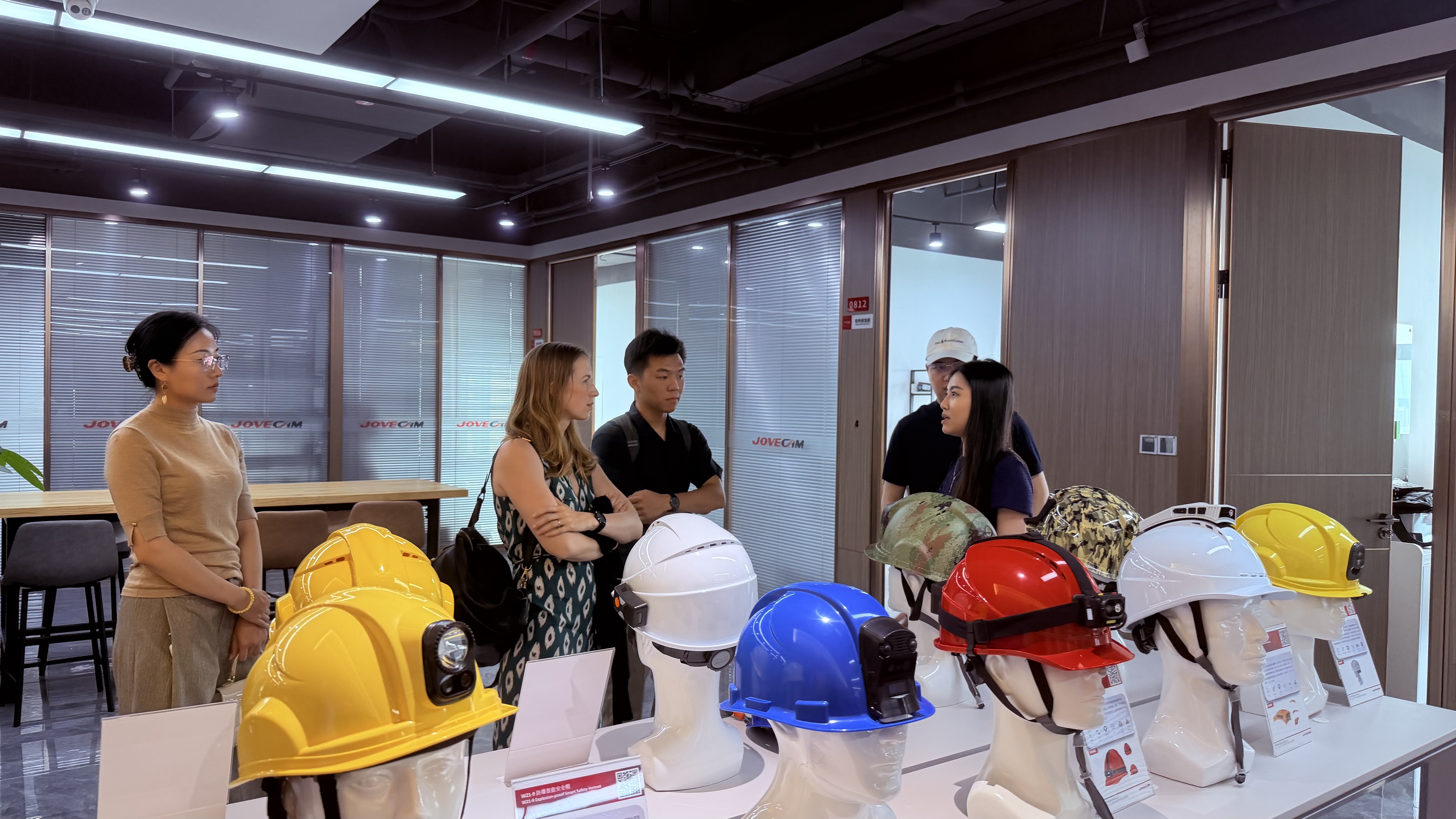 A client meeting with a Shenzhen solution company around a table of product samples