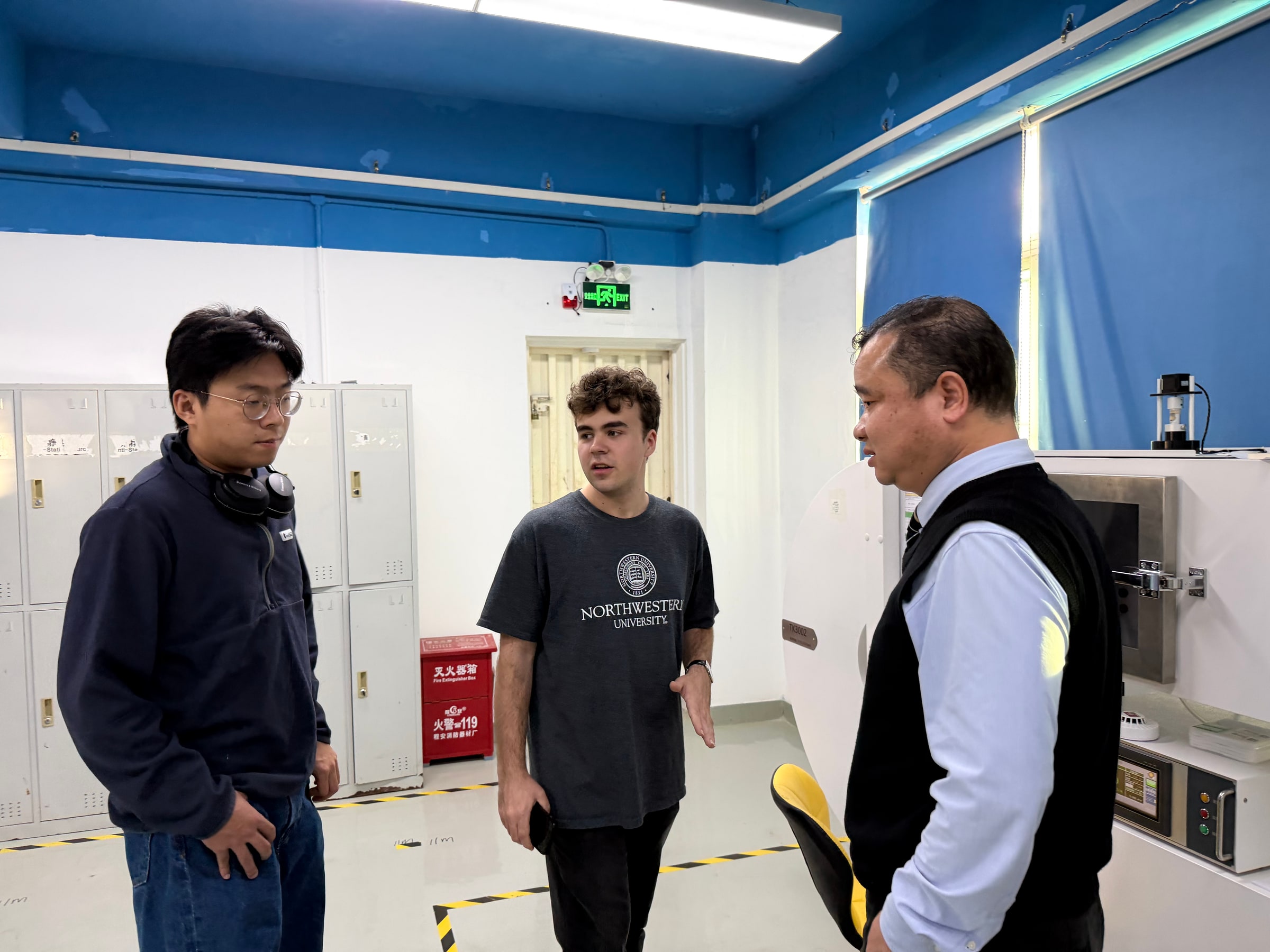 Visitors speaking with a Shenzhen company team during a business visit
